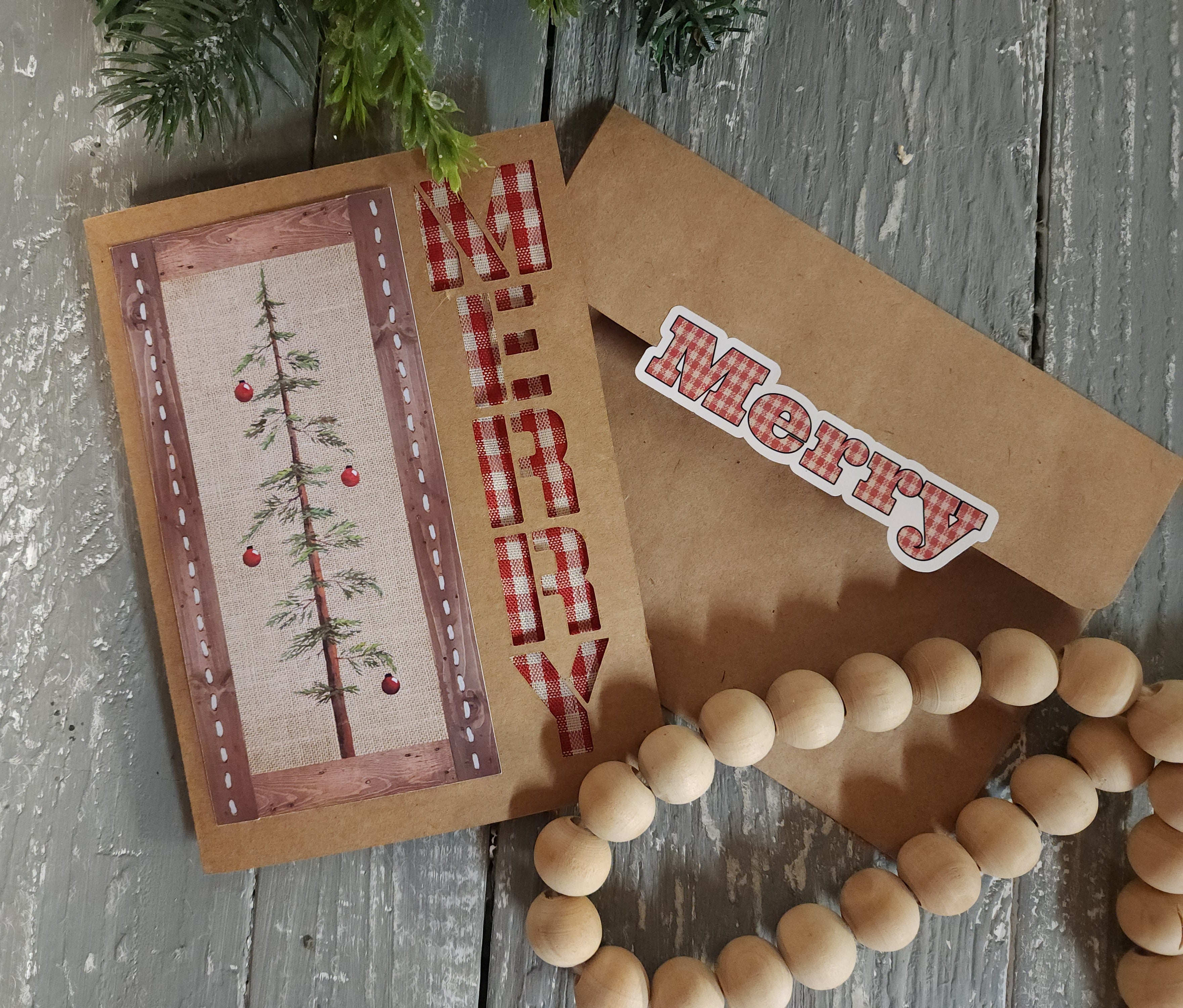 Single Handmade Christmas card with painting print of rustic Christmas tree, red plaid ribbon "MERRY"  Farmhouse brown craft paper