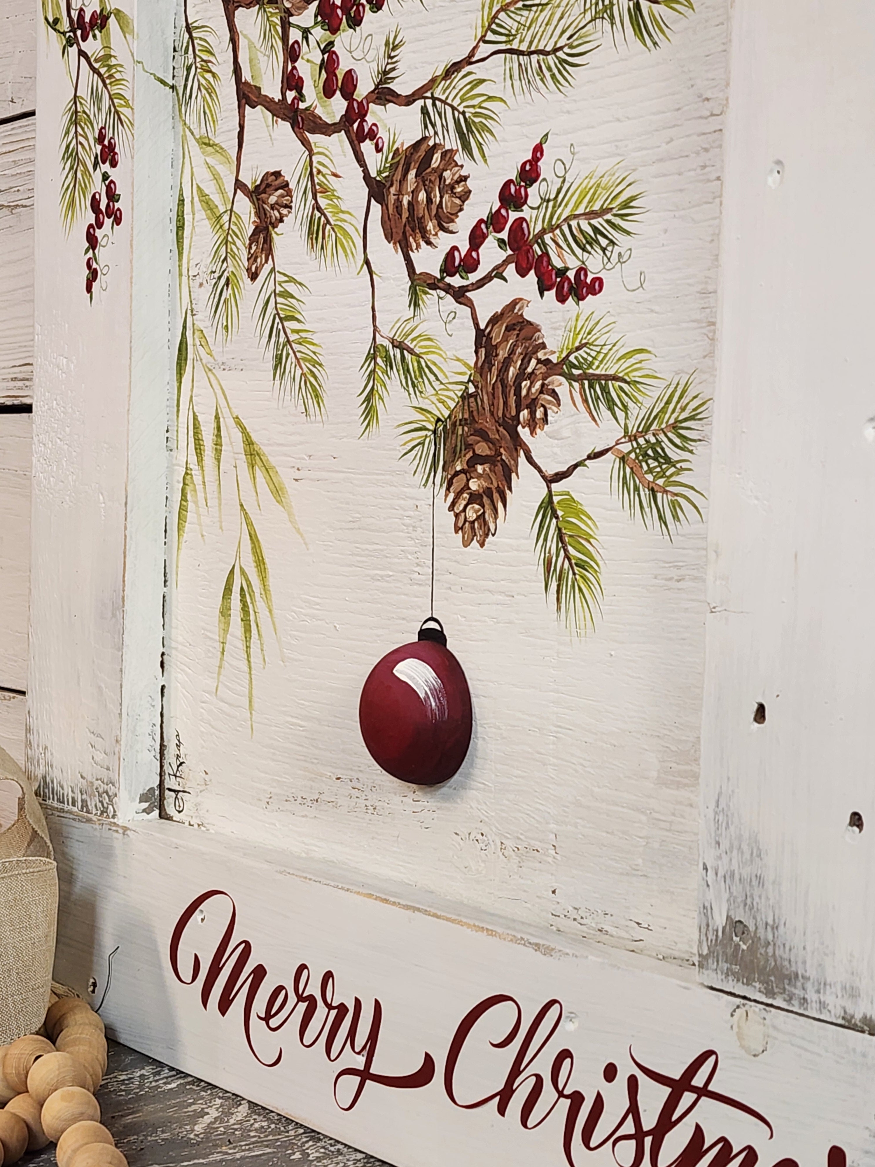 Christmas pine branches and pine cones with 3-d red bulb, painted holiday red berries recycled pallet wood, framed farmhouse Christmas decor