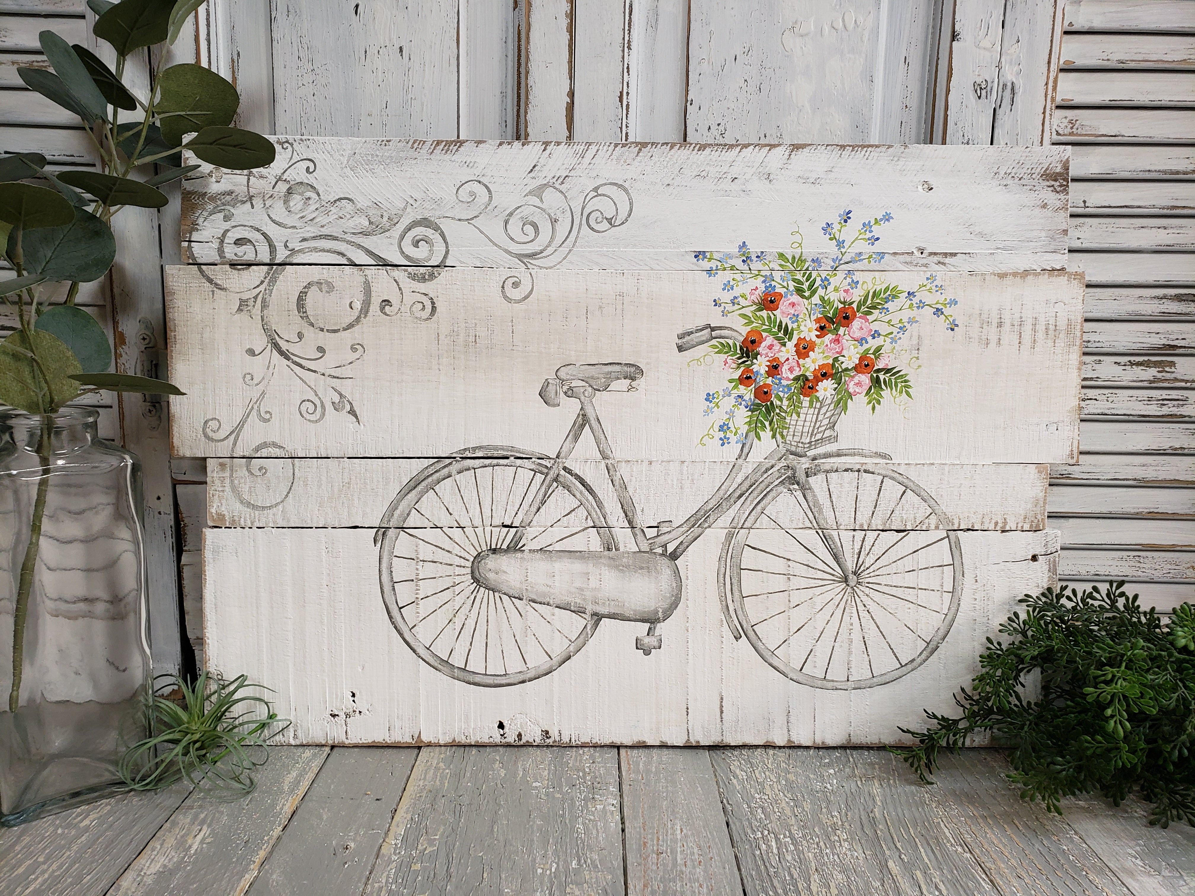 White washed Farmhouse flower decor, hand painted Antique bike with basket of spring flowers on pallet wood